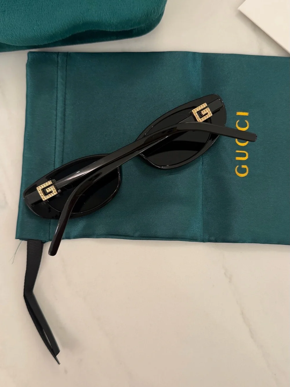 Gucci Black Oval Women's Sunglasses with Dark Lenses